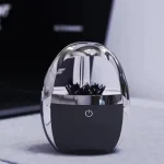 Accessoire de décoration scientifique en verre et métal avec éclairage LED intégré.