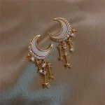 Bijoux lune et étoiles avec cristaux pour un style élégant et mystique.