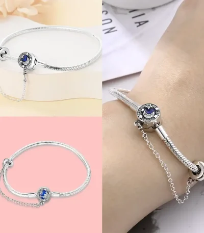 Bracelet en argent avec pendentif étoile et lune, parfait pour une touche élégante et cosmique.