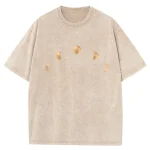 T-shirt beige avec motifs de phases de la lune, style décontracté et tendance.