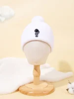 Casquette d'astronaute pour enfant en laine blanche avec un petit motif d'astronaute.