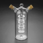 Vase en verre transparent de style scientifique avec deux bouchons en liège, conçu pour la décoration ou l'expérimentation. Parfait pour un décor de style laboratoire ou scientifique.