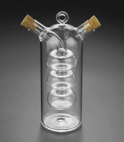 Vase en verre transparent de style scientifique avec deux bouchons en liège, conçu pour la décoration ou l'expérimentation. Parfait pour un décor de style laboratoire ou scientifique.