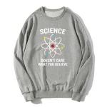 Pull scientifique avec motif atome et slogan inspirant.