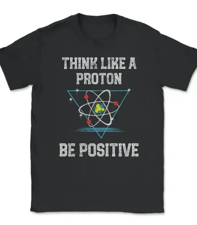 T-shirt noir avec slogan "Think like a proton, be positive" et illustration d'un atome stylisé, parfait pour les amateurs de science et de physique.