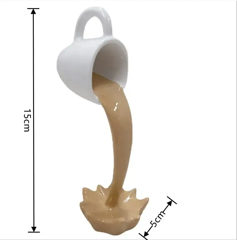 tasse-flottante-a-cafe-1 Petite tasse blanche versant un liquide beige simulant un phénomène scientifique, mesurant 15 cm de haut et 5 cm de large.