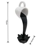 Porte-mug en forme de pelle à charbon, avec liquide noir simulant du charbon en fusion, idéal pour la décoration scientifique ou comme objet insolite.