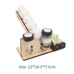 Balancier à billes en bois avec moteur électrique et balles blanches pour expérience scientifique éducative.