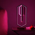 Lampe décorative en forme de diamant rose néon, idéale pour une ambiance moderne et colorée dans une pièce.