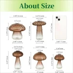 Ensemble de verrerie scientifique en forme de champignon avec différentes tailles, comprenant des flacons en verre avec bouchons en forme de champignon, idéal pour la décoration ou la science.