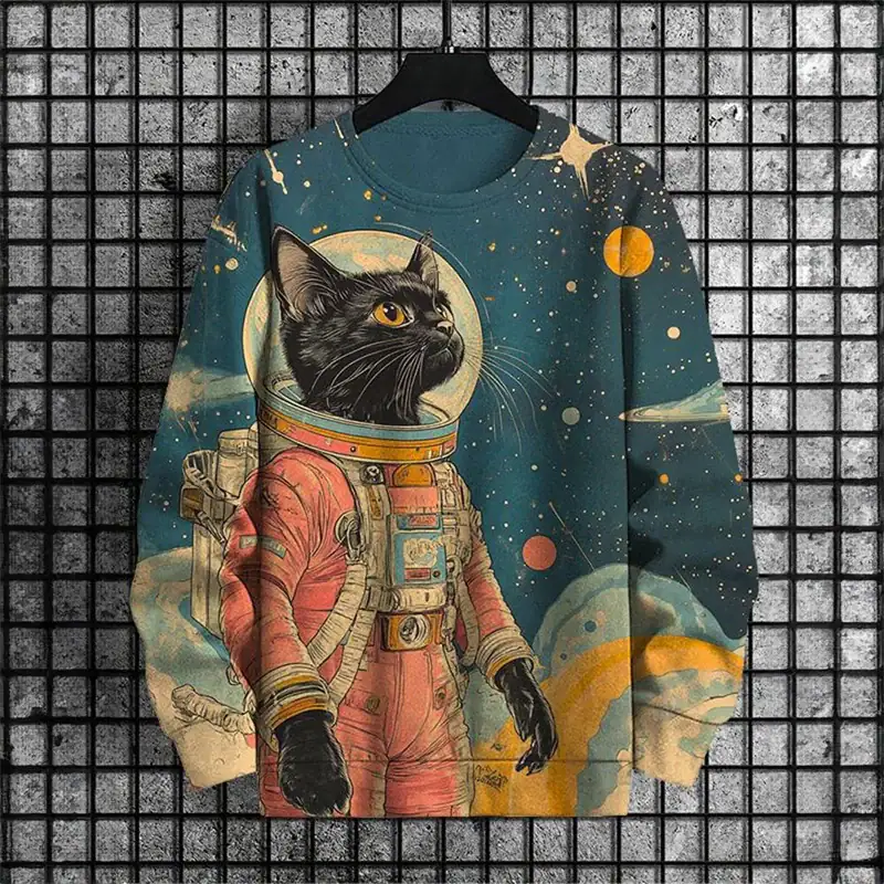 pull-chat-spatial-1 Vêtement pour enfants avec design de chat noir en combinaison spatiale dans un décor cosmique.
