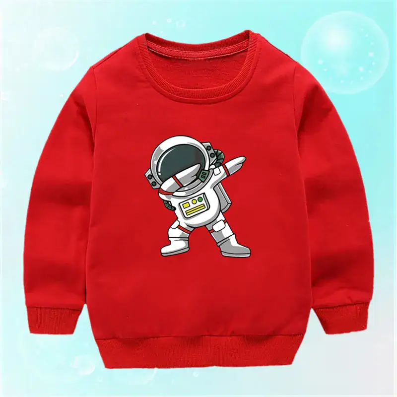 pull-enfant-astronaute-1 Sweatshirt rouge pour enfant avec un motif d'astronaute en style cartoon, parfait pour les amateurs d'espace et de science-fiction.