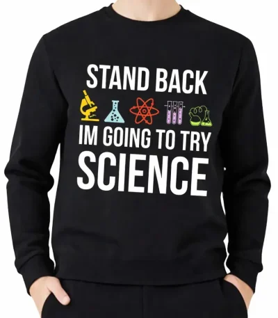 Une veste à capuche noire avec le texte "Stand Back, I'm Going to Try Science" et des icônes de laboratoire colorées, idéale pour les amateurs de science et de décoration scientifique.