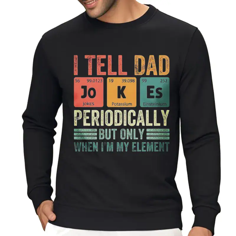 pull-tableau-periodique-dad-jokes-1 Sweatshirt noir avec blague scientifique sur le tableau périodique, mentionnant "Je dis à papa" avec des éléments chimiques et une touche humoristique pour les amateurs de science.